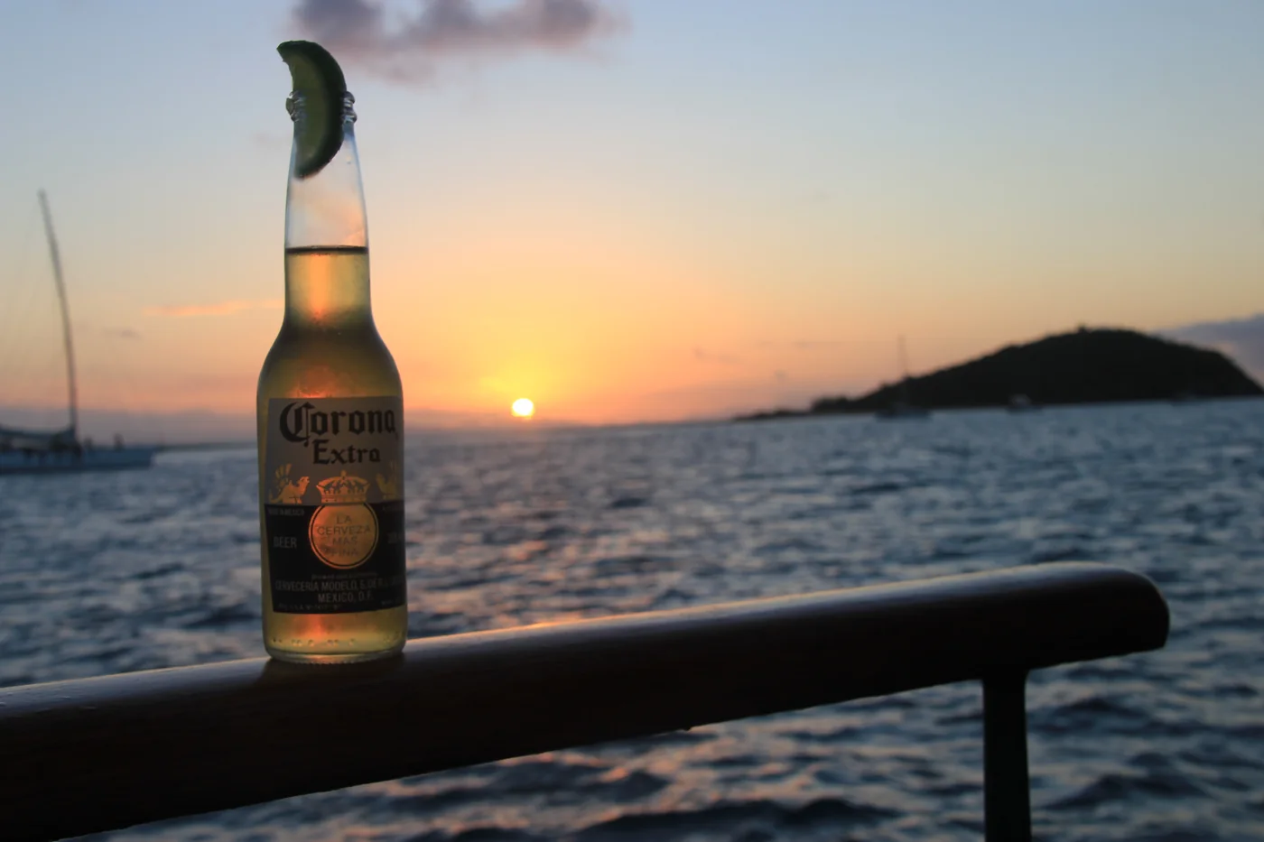 A cold drink on deck at sunset